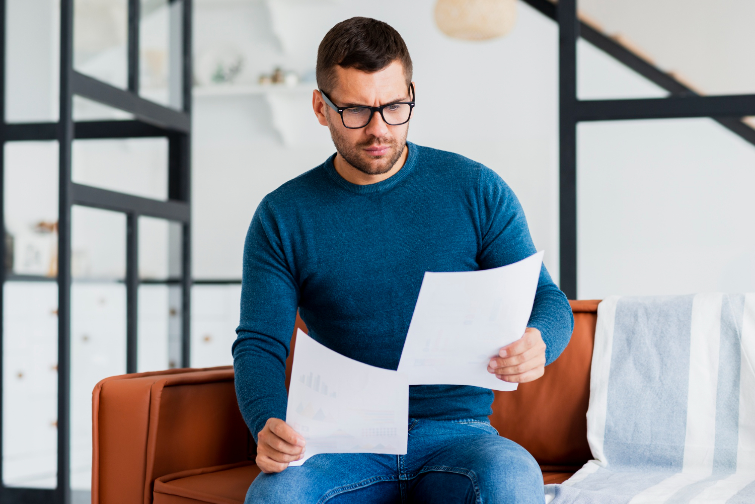 guy looking at paper